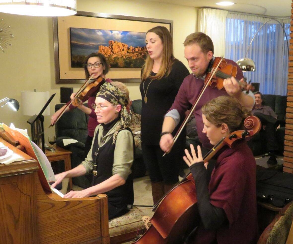 Denny (right back) enjoys the family making music together... Byron's wife Tori Woodrow, Teresa, Byron, Emma, and Claire at piano in one of her weird hairdos.